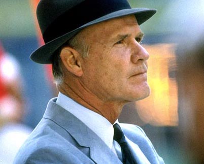 Even more than their Silver Star, Tom Landry (with his fedora hat and gray suit) continues to be the most recognizable symbol of "America's Team" - the Dallas Cowboys.Source: coacheshotseat.com