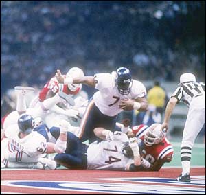 Even defensive prodigy William "Refridgerator" Perry got to carry the ball for Da Bears in Super Bowl XX, shown here barreling over the Patriots into the end zone. Source: ellenpatton.blogspot.com
